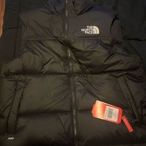 Northface bubble vest for men.Never worn/ used in store bought condition.Size XL